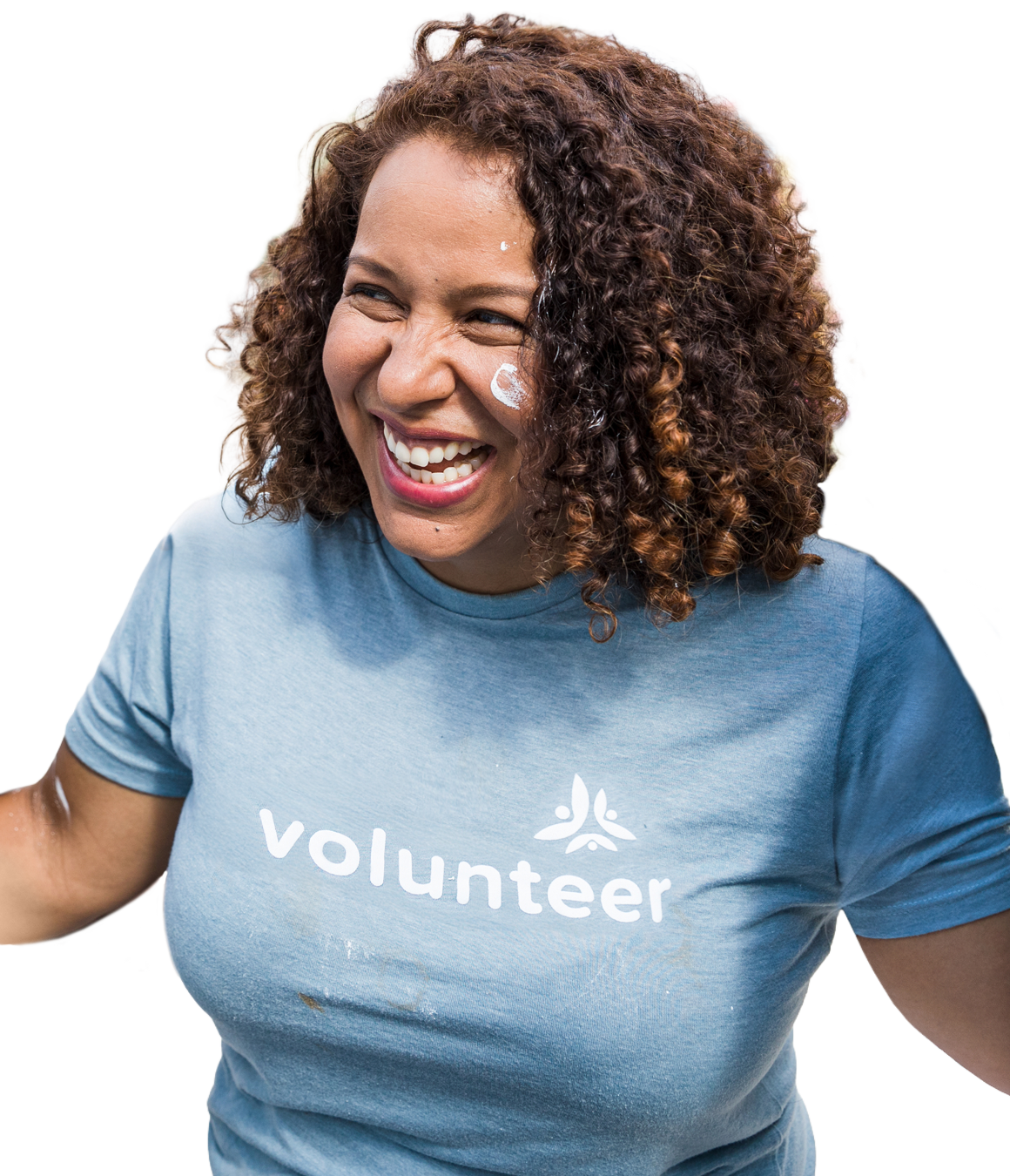 Smilling volunteer with curly hair in a pale blue tshirt