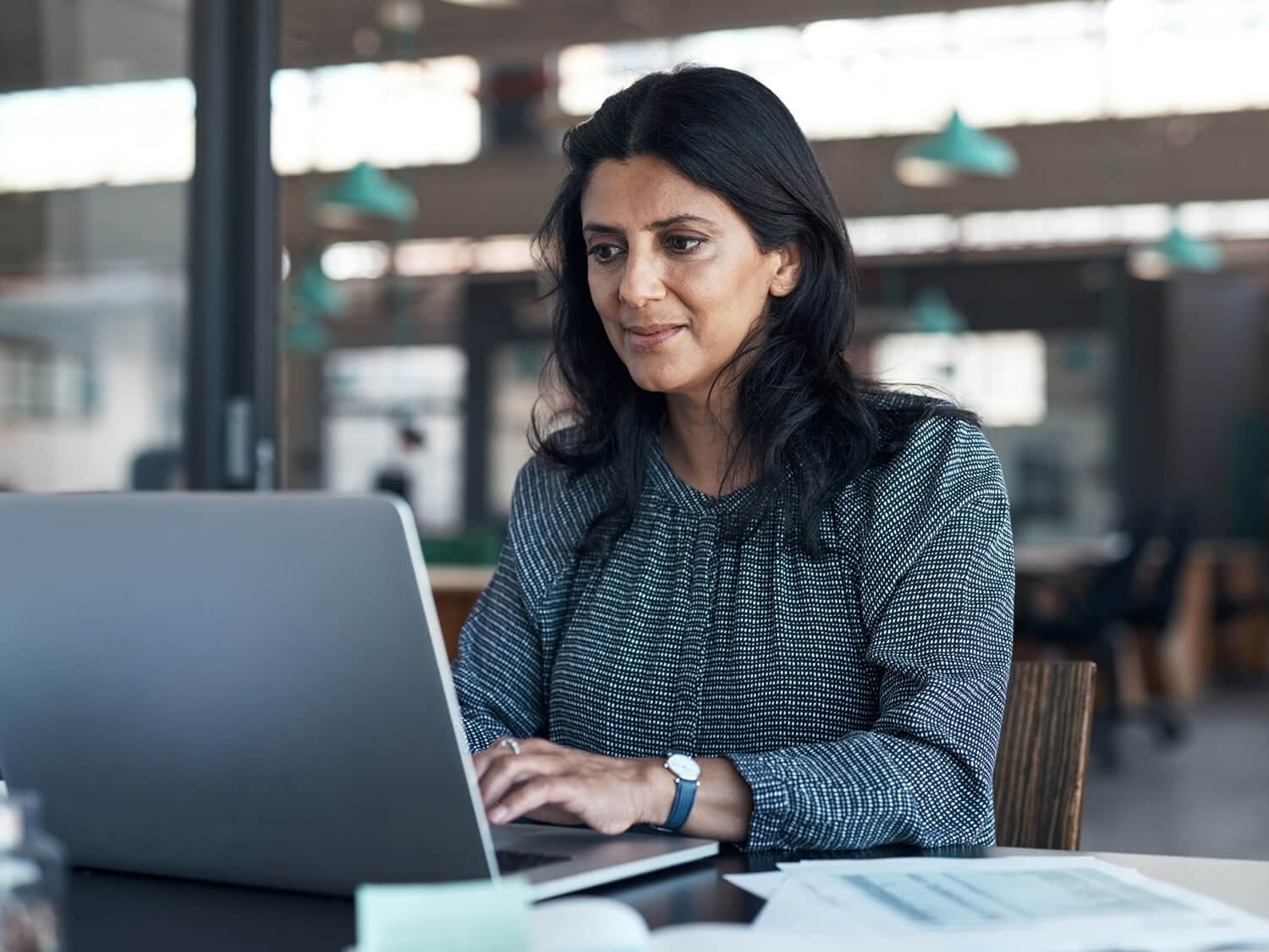 A corporate employee completing a volunteering assesment online at her laptop